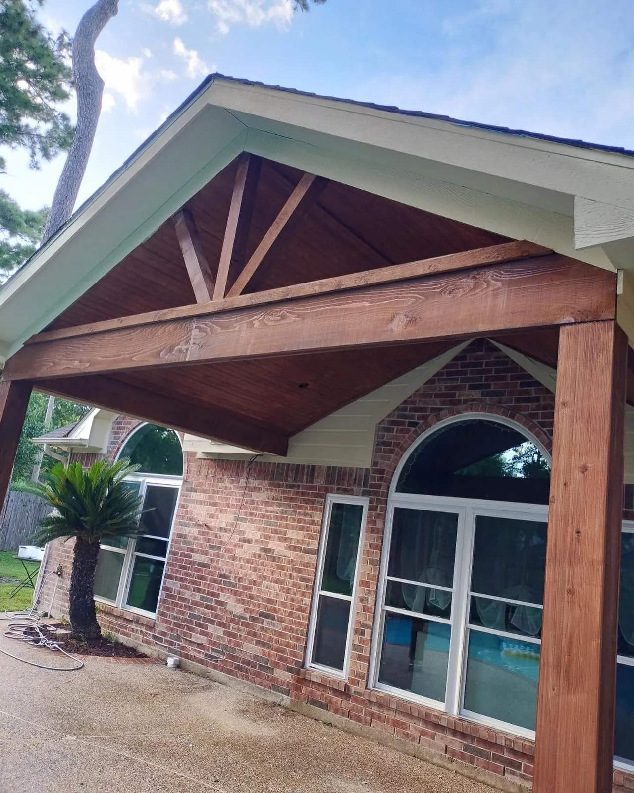 Detailed brick column and stained cedar gable craftsmanship